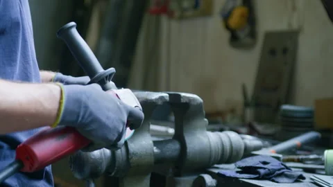 Close-Up of Blacksmith Grinding Metal by Hand – Intense Sparks Flying Stock Footage 313850950
