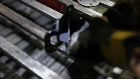 Close-up blacksmith welder in protective mask works with metal using a welding Stock Footage 139587928