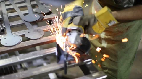 Close-up blacksmith welder in protective mask works with metal using a welding Stock Footage 139588229