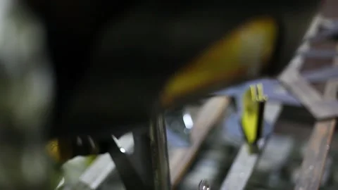 Close-up blacksmith welder in protective mask works with metal using a welding Stock Footage 139589829