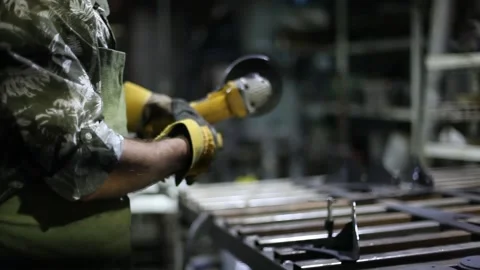 Close-up blacksmith welder in protective mask works with metal using a welding Stock Footage 139590232