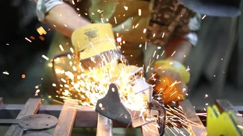 Close-up blacksmith welder in protective mask works with metal using a welding Stock Footage 139592291