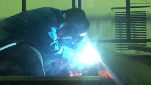 Close-up blacksmith welder works with  welding machine. Stock Footage 182729142