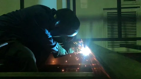 Close-up blacksmith welder works with  welding machine. Stock Footage 182729169