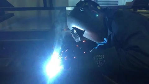 Close-up blacksmith welder works with  welding machine. Stock Footage 182729275
