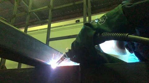 Close-up blacksmith welder works with  welding machine. Stock Footage 182729281