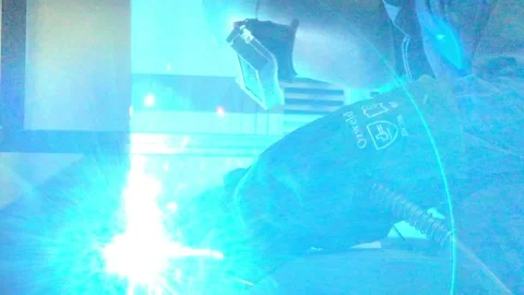 Close-up blacksmith welder works with  welding machine. Stock Footage 182729338