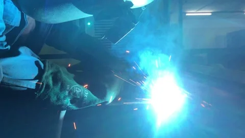 Close-up blacksmith welder works with  welding machine. Stock Footage 182729347