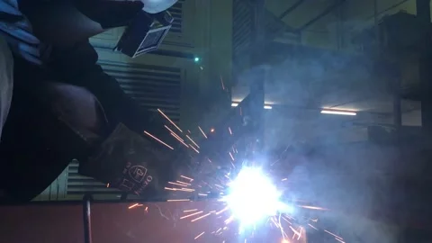 Close-up blacksmith welder works with  welding machine. Stock Footage 182729415