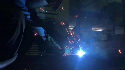 Close-up blacksmith welder works with  welding machine. Stock Footage 182729545