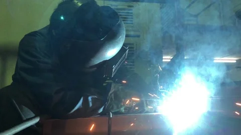 Close-up blacksmith welder works with  welding machine. Stock Footage 182729650