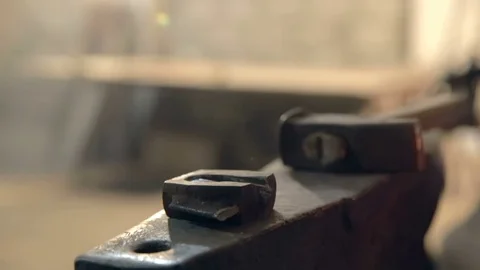 Close-up blacksmith who shapes hot steel with a hammer Stock Footage 76399673
