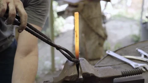 Close up blacksmith working metal with hammer on the forge Stock Footage 218267569