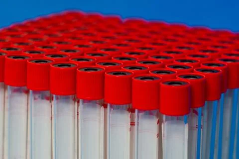 Close up blank laboratory test tubes with red caps ready for use Stock Photos