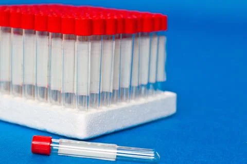 Close up blank laboratory test tubes with red caps ready for use Stock Photos