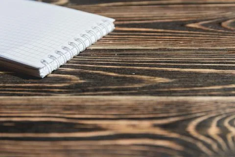 Close up Blank Note Book on Grunge Wood Stock Photos