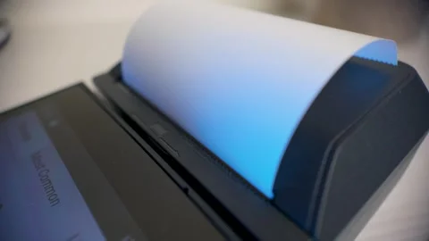 Close up of blank receipt printing from POS terminal during payment process Stock Footage 325962189