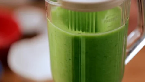 Close up of a blender making a green smoothies Stock Footage 95927998
