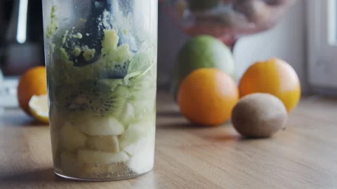 Close-up of a blender processing fresh fruits Stock Footage 331856302