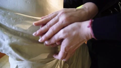 Close up of blind man's hands touching a replica of the Aphrodite de Milo at Video stock 148376622