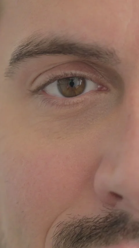 Close Up of Blinking Eyes of Man, vertical video 스톡 동영상 328555114