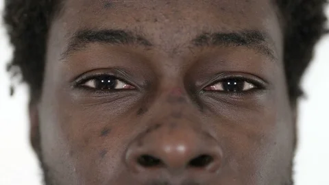Close up of Blinking Eyes of Young African Man Stock Footage 113249092