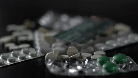 Close-up of blister packs of tablets and capsules of various shapes Stock Footage 288590589