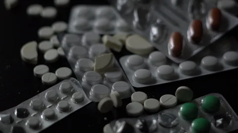 Close-up of blister packs of tablets and capsules of various shapes Stock Footage 288590837