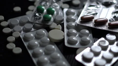 Close-up of blister packs of tablets and capsules of various shapes Video stock 288590908