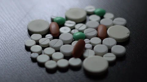 Close-up of blister packs of tablets and capsules of various shapes Stock Footage 288591014