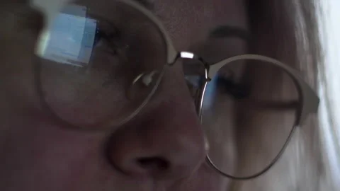 Close-up blonde 40 years old uses a computer, the monitor is reflected in g.. Stock Footage 233169945