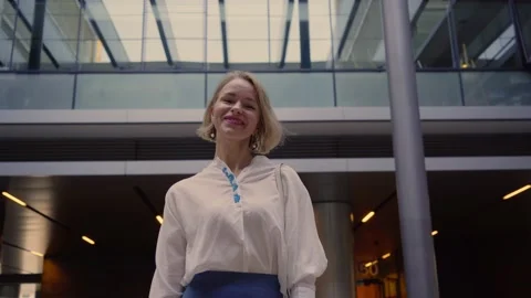 Close up of a blonde, Caucasian, middle-aged, smiling business woman looking Stock Footage 233471693