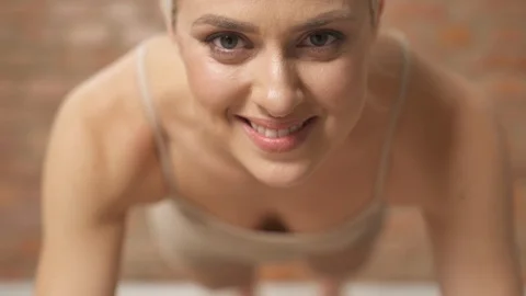 A close-up of blonde-haired woman's smiling face looking at the camera Stock Footage 101820951