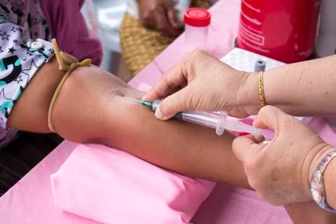 Close up of blood extraction in lab Stock Photos