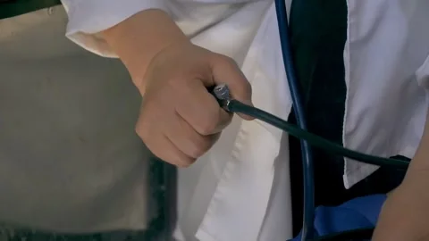 Close-Up of Blood Pressure Measurement Using Manual Sphygmomanometer Stock Footage 314303143
