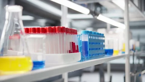 Close up of blood samples in test tubes and reagent solutions Stock Footage 320721285