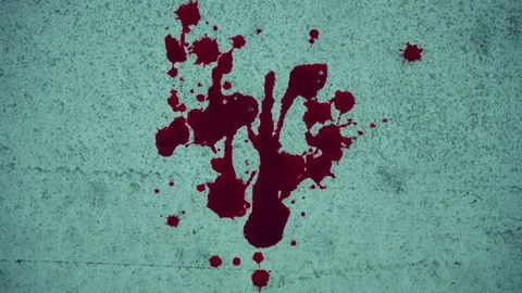 Close-up of blood stains on a wall or crosswalk asphalt. Bloody road crime scene Stock Footage 318624627