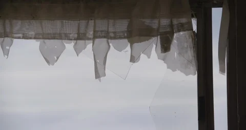 Close Up of Blowing Curtains on Broken Windows Stock Footage 89942147