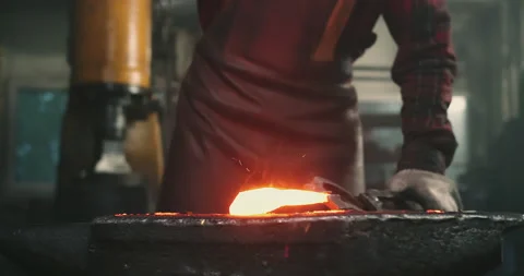Close-up blows on hot metal Stock Footage 165213499