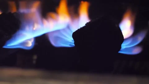Close-up of Blue and Orange Flames on a Gas Stove Burner Stock-Footage 332814601