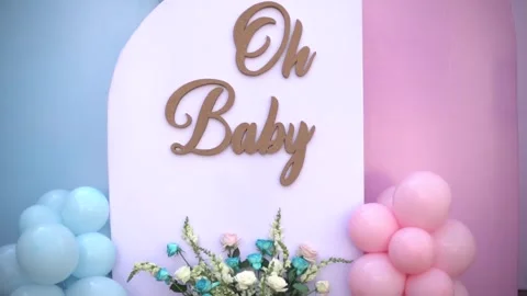 Close-up of Blue and Pink Balloon Garlands for Baby Gender Reveal Celebration Stock Footage 341008630