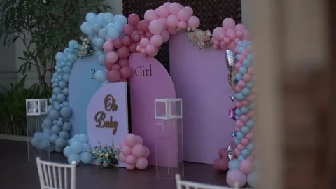 Close-up of Blue and Pink Balloon Garlands for Baby Gender Reveal Celebration Stock Footage 341008994
