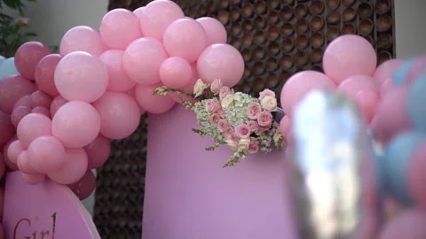 Close-up of Blue and Pink Balloon Garlands for Baby Gender Reveal Celebration Stock Footage 341009451