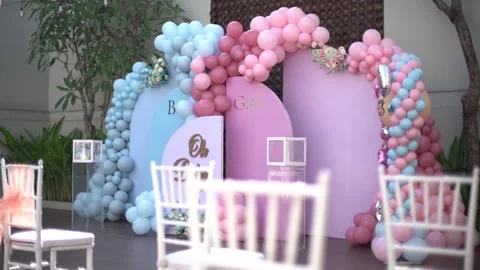 Close-up of Blue and Pink Balloon Garlands for Baby Gender Reveal Celebration Stock Footage 341016604