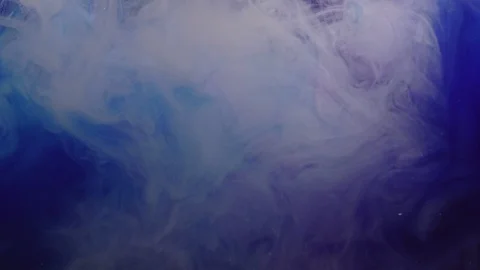 Close-up of blue and white paint scattered on a dark background Stock Footage 114321340