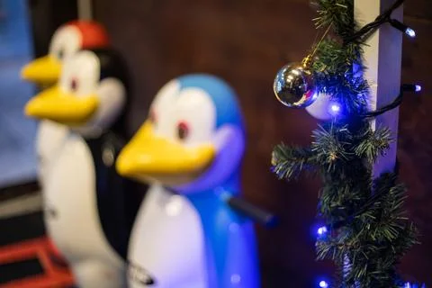 Close-up of a blue and white plastic penguin ice skating aid with a blurred Stock Photos