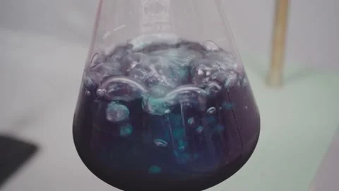 Close up of blue boiling liquid in chemistry lab, 4K Stock Footage 133948701