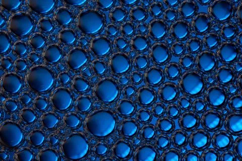 Close-up of blue bubbles, abstract background. Stock Photos