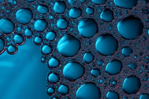 Close-up of blue bubbles forming a pattern, abstract background. Foto stock