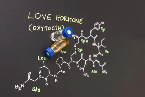 Close-up blue cap sample vial on paper with chemical formula of Oxytocin Stock Photos